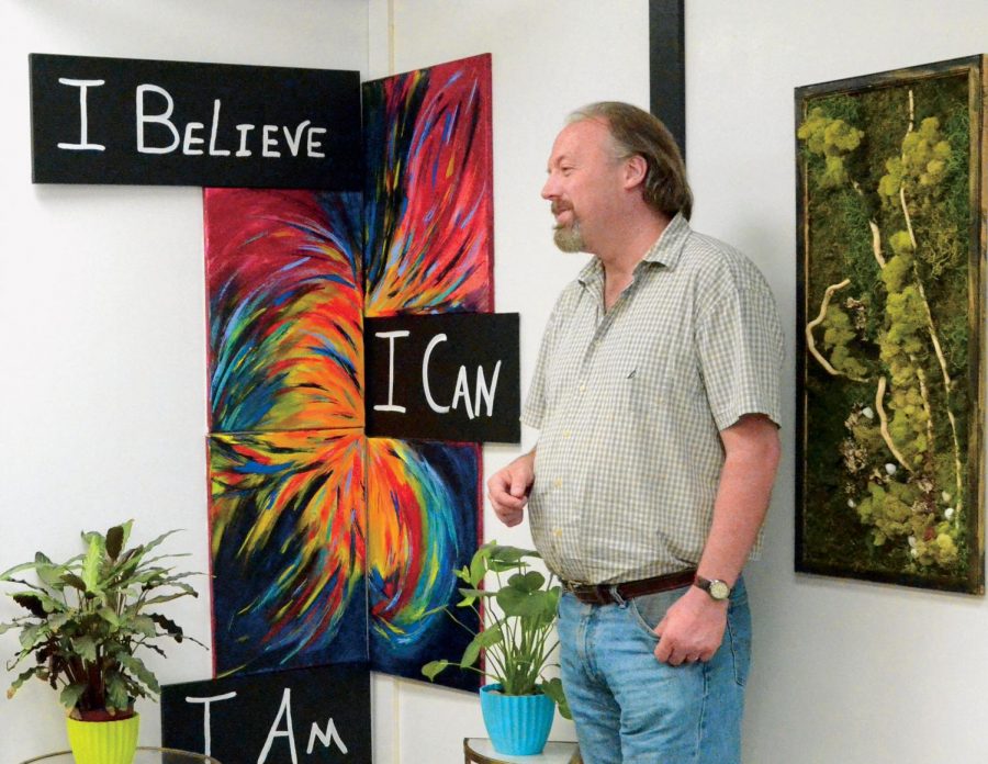 Darrell Keim, director of the Latah Recovery Center, talks about the art pieces on the walls of the center Wednesday.