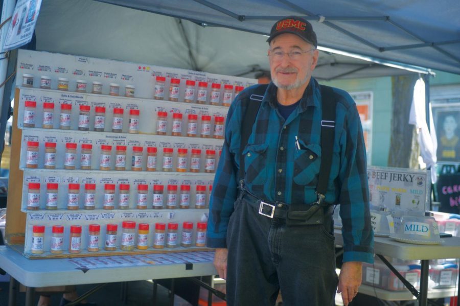 Ray Templeton, owner of Redneck Seasonings, shows off the variety of spices he offers at the Moscow Farmers Market on Saturday.