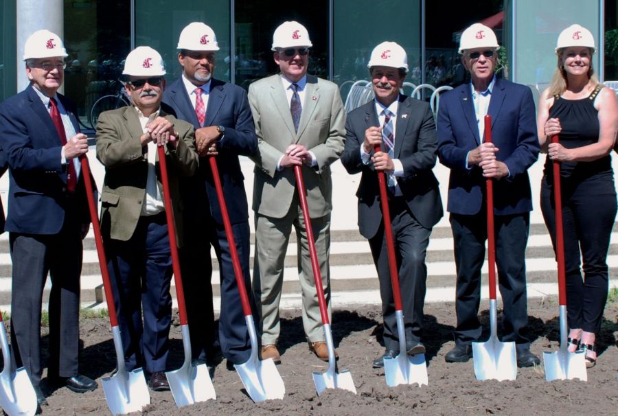 A+group+of+administrators+and+state+officials+break+ground+at+the+location+of+the+new+plant+sciences+building+Wednesday.