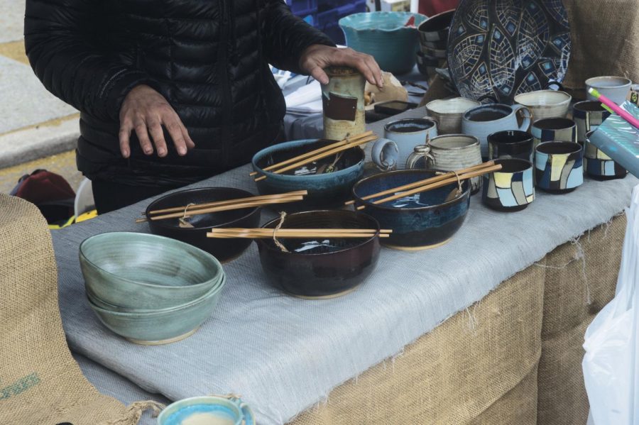 Kassie Smith, owner of KSmith Ceramics, explains how she makes ramen bowls with chopstick holders on June 16 at the Moscow Farmers Market.
