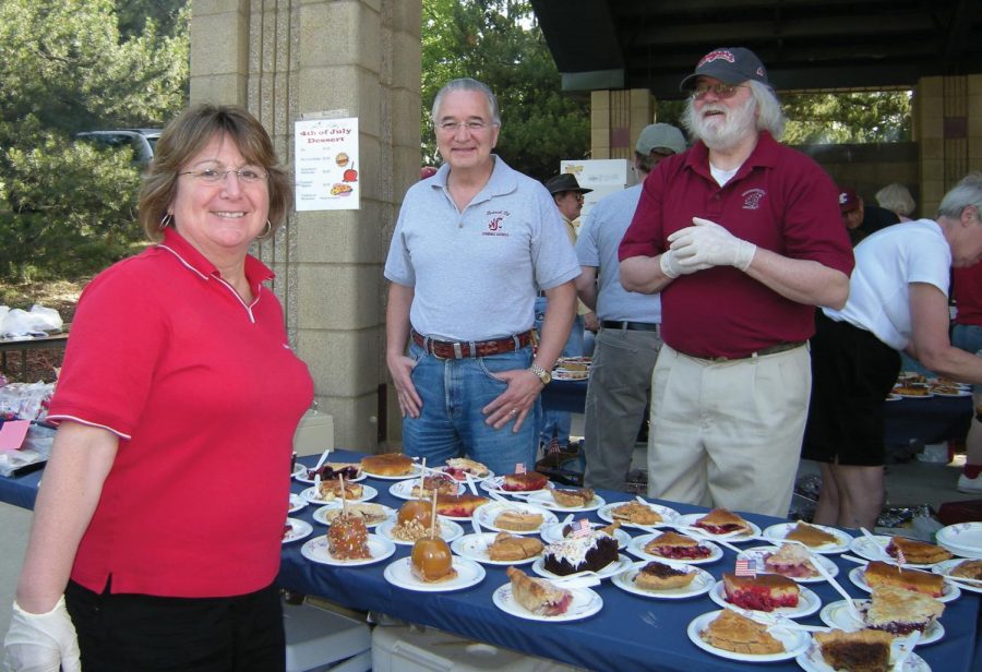 Linda Mittelhammer, from left, her husband Ron and Don Blaney pose near the pie table at the Fourth of July celebration in Sunnyside Park in 2010.