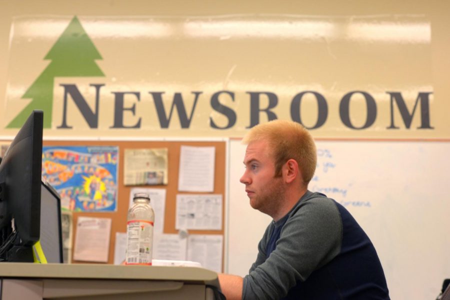Daily Evergreen Editor-in-Chief Dylan Greene lays out pages for production on Monday in The Daily Evergreen newsroom. 