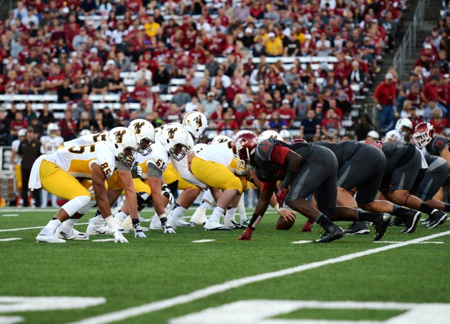 University of Wyoming and WSU players face off on the line of scrimmage Sept. 19, 2015 in Martin Stadium.