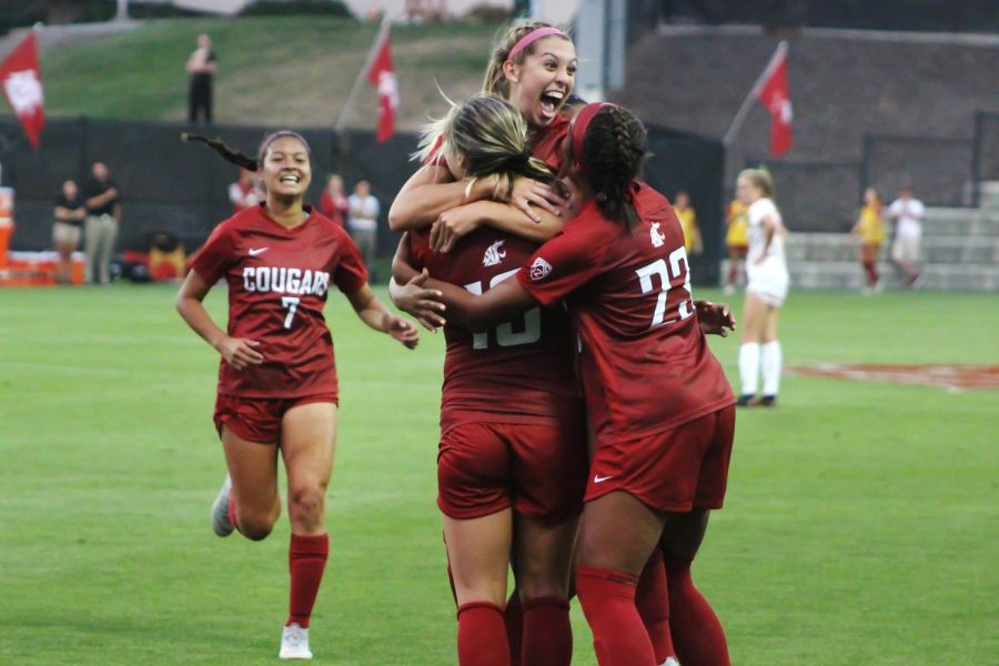 Junior forward Morgan Weaver, top, celebrates her 20-yard goal, that gave WSU a 3-1 lead over Seattle University on Aug. 17 at the WSU Lower Soccer Field.