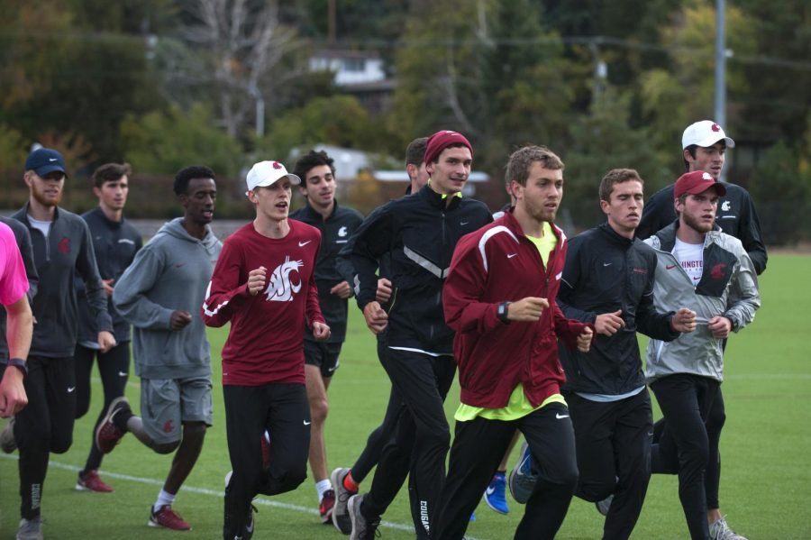 Members of the 2016 men’s cross country team run during practice October 2016 at the Valley Road Playfields.