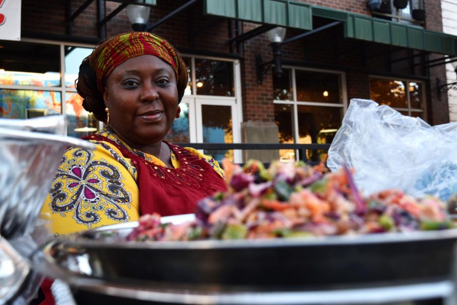 Nnenna Aggda, who competed in the salad competition, shows off the ingredients used in her homemade “Yommy Salad (My Creation)” on Friday evening at the Pullman Good Food Co-optastic Carnival on Pine Street Plaza.  