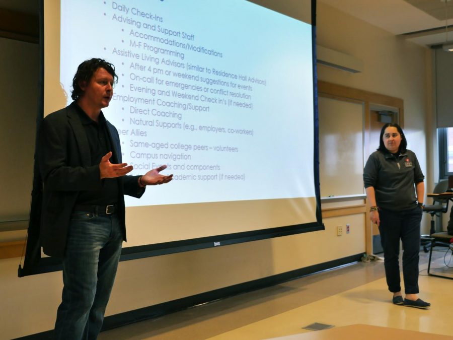 Assistant professors of Special Education Don Mcmahon, left, and Brenda Barrio, right, discuss the ROAR program April 12 in the Education Addition building.