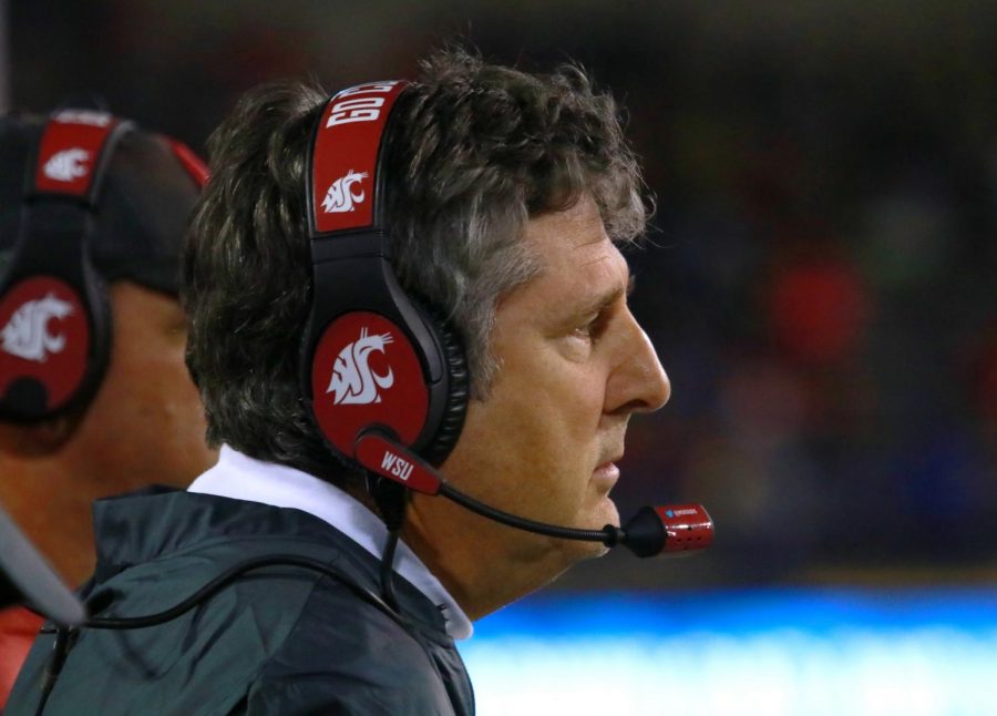 Head Coach Mike Leach watches the game from the sidelines Saturday night at Martin Stadium.