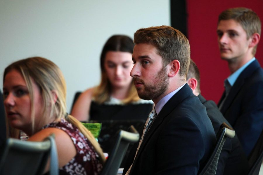 ASWSU Senator Taylor Swanson hears a progress update from Director of University Affairs Bailey Fillinger at Wednesday’s ASWSU meeting in the CUB.