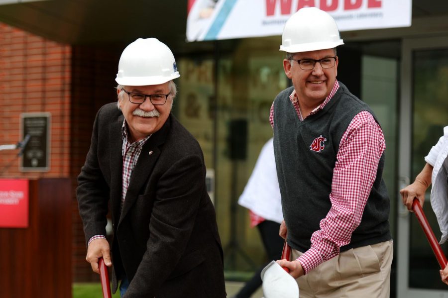 Dean of College of Veterinary Medicine Bryan Slinker, left, and WSU President Kirk Schulz break ground on the Paul G. Allen Center for Global Animal Health during the dirt ceremony Saturday.