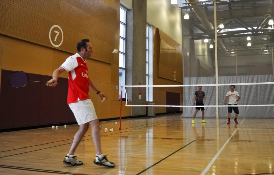 Members of the WSU Badminton Club play a game Wednesday in the UREC.