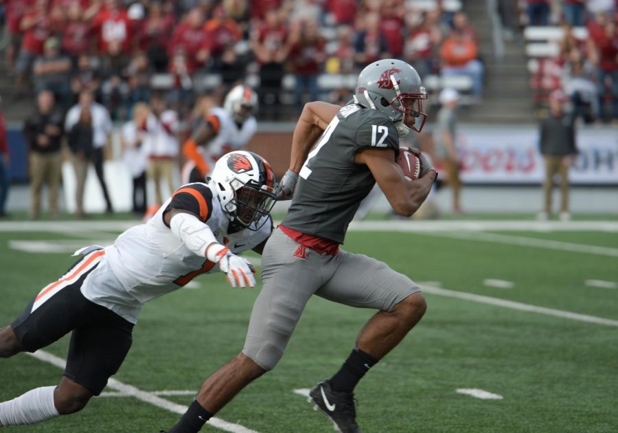 Then-sophomore wide receiver Dezmon Patmon charges forward to gain extra yards after his initial catch to get the first down against Oregon State on Sept. 16, 2017 at Martin Stadium.