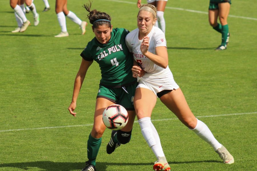 Junior forward Morgan Weaver battles against Cal Poly freshman defender Emily Talmi to take control of the ball in a game last Sunday at the Lower Soccer Field. The Cougars won 4-1.
