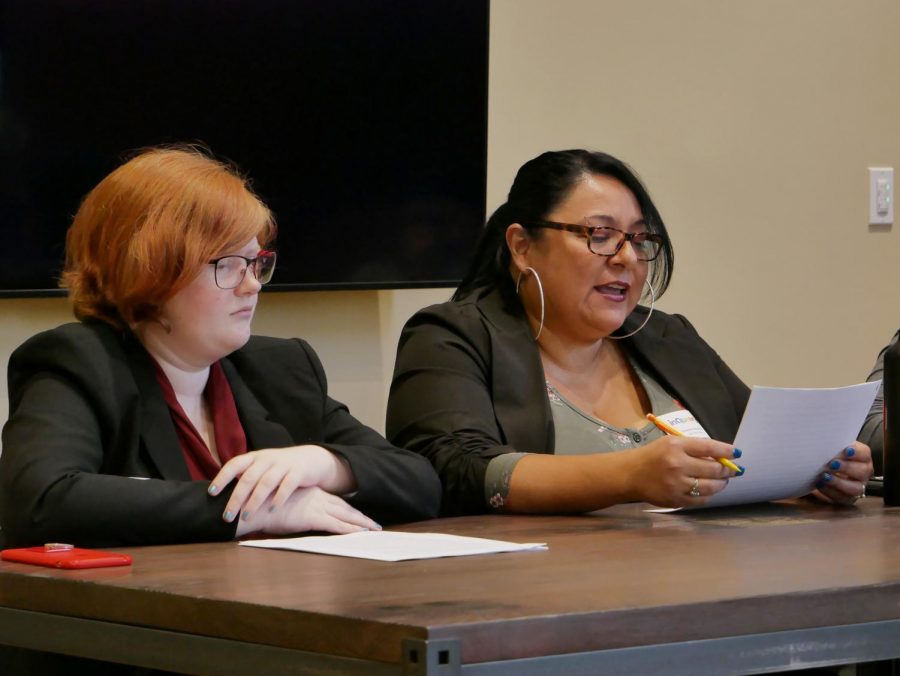 Undergraduate Shea Cooke, left, and American studies graduate student Veronica Sandoval read their papers on race and sexuality in society at the InQueery event Monday at the Elson S. Floyd Cultural Center.