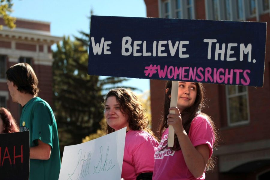 WSU Planned Parenthood Generation Action members hold up signs in protest of Kavanaugh’s potential confirmation Wednesday on Glenn Terrell Friendship Mall.