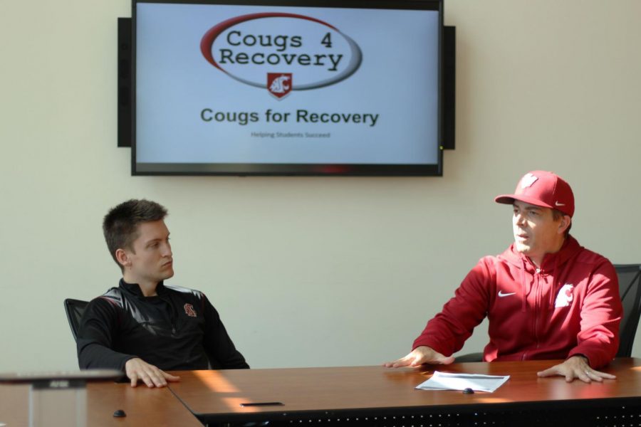 Jonathan Wallis, Cougs For Recovery president, left, and doctoral candidate Noel Vest, right, discuss Cougs for Recovery on Wednesday at the Compton Union Building.