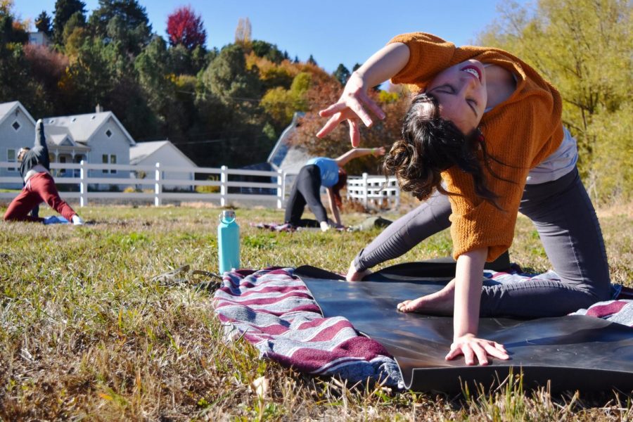 Yoga Instructor Tiffany Alvarez guides her students to channel their energy and become more aware of their bodies’ reactions to each pose at the Beer + Yoga = Brewga event Sunday afternoon at the Paradise Creek Trailside Taproom.