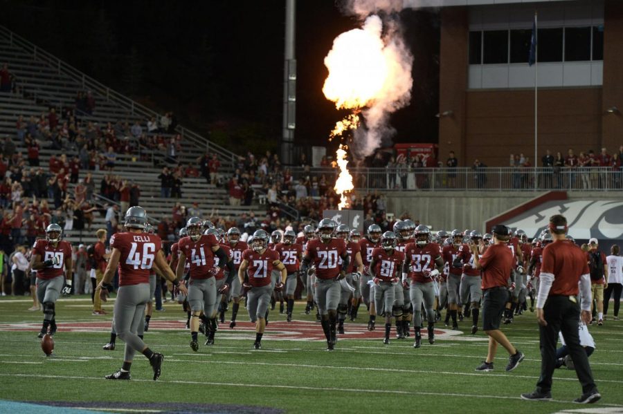The WSU football team runs onto the field before the San Jose State game Sept. 8 at Martin Stadium.