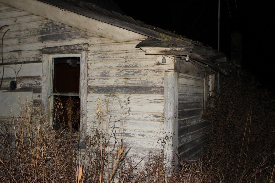 The exterior of the abandoned Hamilton House on Saturday in Colfax, Washington, looms in the darkness before Evergreen employees entered. With the intention to stay until the witching hour, the on-scene clairvoyant attempted to ask why the spirits are inhabiting the house. However, the spirits became agitated and the group was driven out of the house.