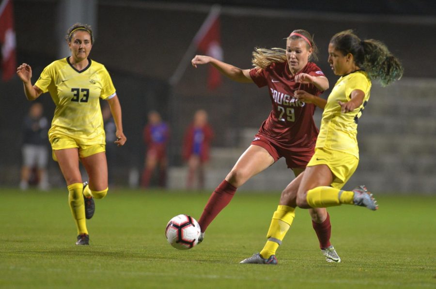 Redshirt+junior+forward+Alysha+Overland+steps+in+to+beat+Oregon%E2%80%99s+sophomore+defender+Mia+Palmer+to+the+ball+on+Sept.+27+at+the+Lower+Soccer+Field.+Overland+has+scored+two+goals+on+nine+shots+this+season.