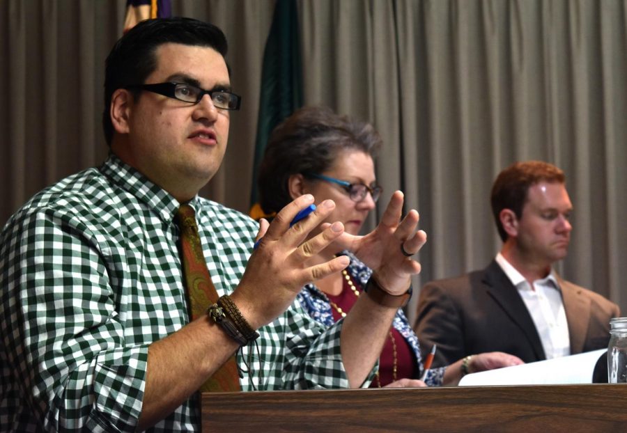 Councilmember Brandon Chapman, left, discusses the benefits of changing Columbus Day to Indigenous Peoples’ Day on Tuesday at the City Council meeting.