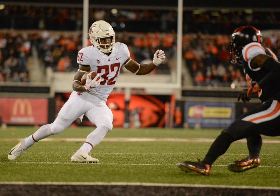 Redshirt junior running back James Williams jukes the Oregon State University defense to run the ball into the end zone Oct. 6 at Reser Stadium. Williams has eight total touchdowns and leads the team with 267 rushing yards.