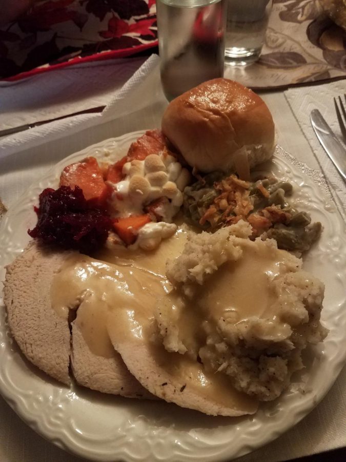 Fall 2018 assistant sports editor Taylor Dunlap enjoys her Thanksgiving dinner with her family. Her family watches football until dinner on the holiday and plays board games after.