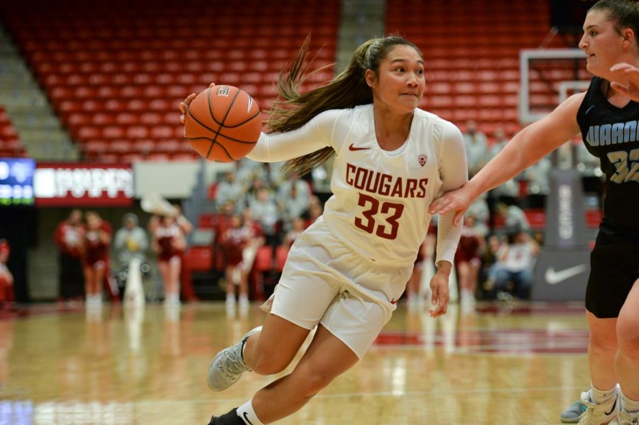 WSU+freshman+guard+Cherilyn+Molina+dribbles+to+the+hoop+against+WPU%E2%80%99s+sophomore+guard+Katelyn+Rossback+in+the+matchup+at+Beasley+Coliseum+on+Oct.+29.+The+Cougars+won+106-41+as+Molina+hit+four+of+her+eight+field+goals+and+finished+with+15+points.