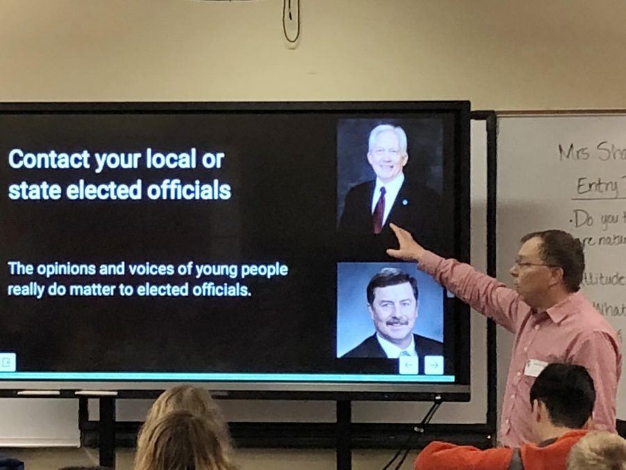 Larry Clark, co-founding member of nonpartisan organization Palouse ProActive, teaches a civics lesson on how to contact your representatives to a eighth grade U.S. history class at Lincoln Middle School on Friday.