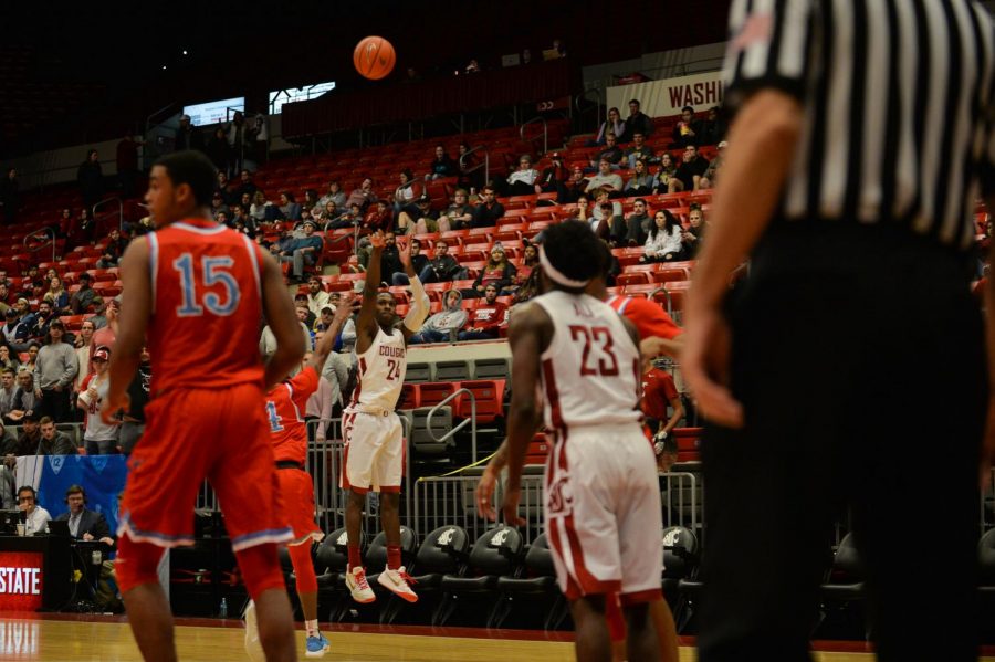 Senior guard Vionte Daniels shoots a three-pointer in the game against Delaware State University on Saturday night in Beasley Coliseum.