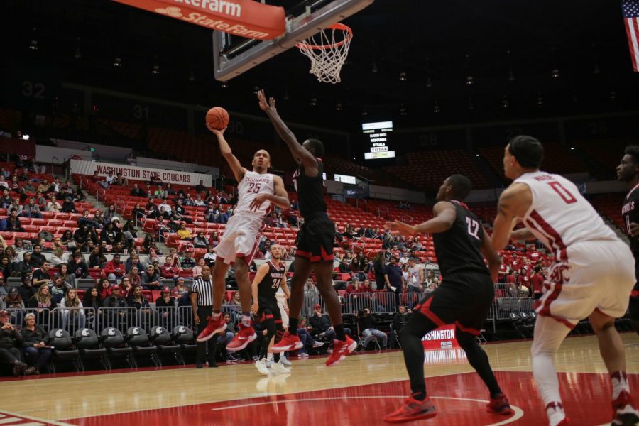 Redshirt sophomore forward Arinze Chidom attempts a layup during the game against Nicholls State University on Sunday in Beasley Coliseum. Arinze made five out of 10 attempts in the game resulting in 10 points for the night.