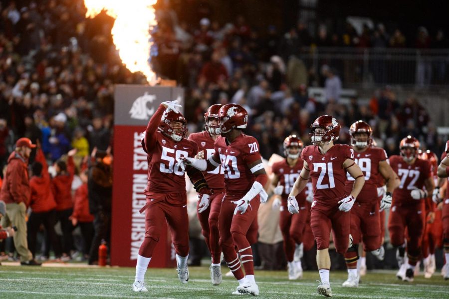 The+WSU+football+team+runs+onto+field+before+the+start+of+the+game+against+Cal+on+Nov.+3+in+Martin+Stadium.