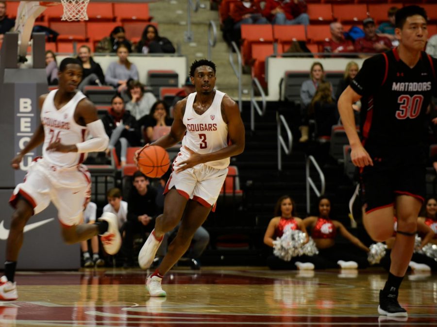 Senior forward Robert Franks Jr. dribbles the ball down the court during the game against Cal State Northridge on Tuesday night at Beasley Coliseum. 