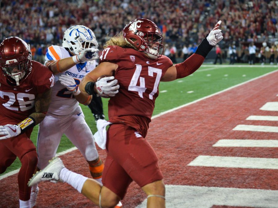 Then-redshirt senior linebacker Peyton Pelluer returns an interception for a touchdown against Boise State University on Sept. 9, 2017, at Martin Stadium. Four generations of Pelluers have played for the Cougars, starting with Peyton’s great-grandfather.