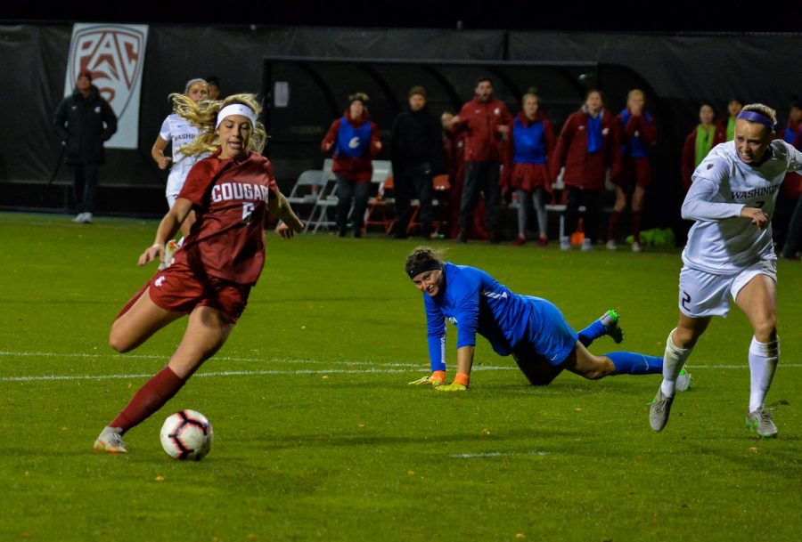 Junior forward Morgan Weaver takes a shot on the goal during the matchup against UW on Friday evening at the Lower Soccer Field. Weaver scored all three of WSU's goals, bringing her season total to 12.