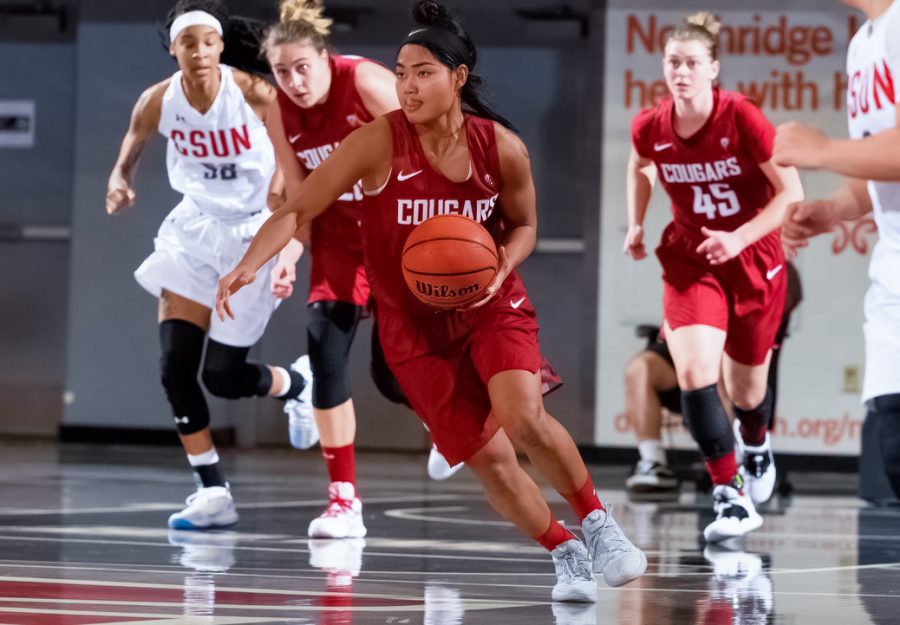 Junior guard Chanelle Molina drives down the court in the game against California State Northridge on Nov. 23. The Cougars extended their winning streak to three games and made 90-plus points for the second game in a row Saturday in Beasley Coliseum.
