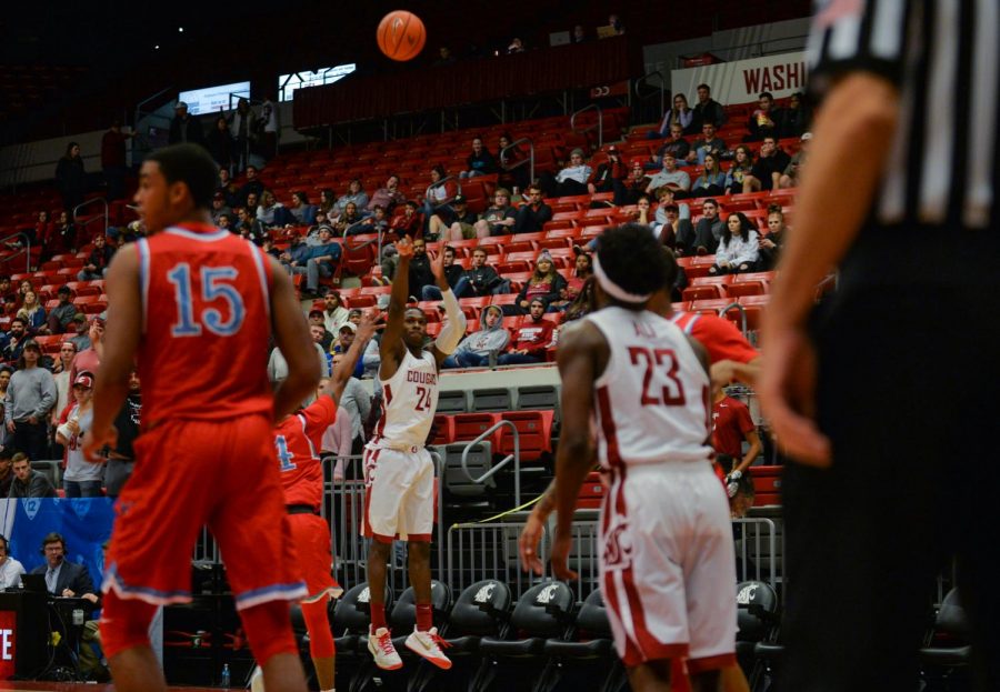 Senior guard Viont’e Daniels shoots a three-point shot in a game against Delaware State on Nov. 24 at Beasley Coliseum.