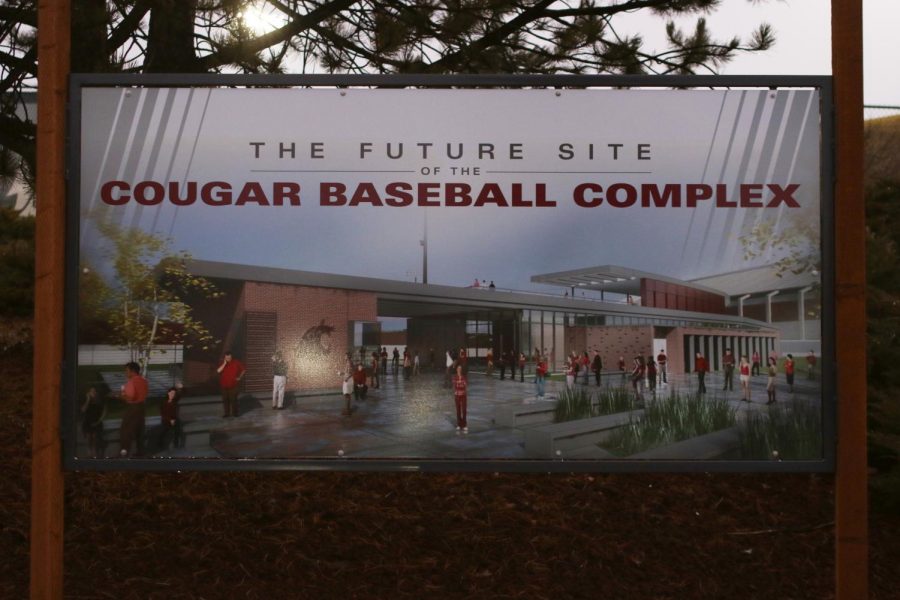 A sign showcases the proposed cougar baseball complex outside Bailey-Brayton Field.