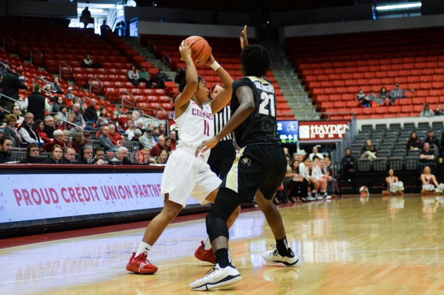 Junior guard Chanelle Molina looks for a teammate during the game against Colorado on Sunday at Beasley Coliseum. 