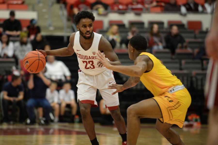 WSU junior guard Ahmed Ali tries to get past Cal junior guard Paris Austin during a game Jan. 17 at Beasley Coliseum. The game resulted in a 82-59 win for the Cougars.