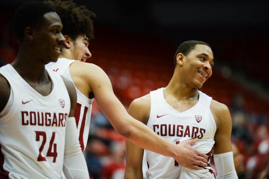 From left, senior guard Viont’e Daniels freshman forward CJ Elleby and junior point guard Jervae Robinson celebrate in the game against Cal on Jan. 17 at Beasley Coliseum. WSU won 82-59.