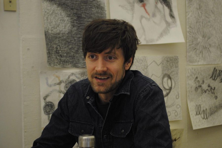 Joe Hedges, an assistant professor of painting and intermedia, tells how art, or lack thereof, can affect students at WSU on Monday morning in the Fine Arts Center. He said student artwork helps address the issue of noticeably missing creativity.