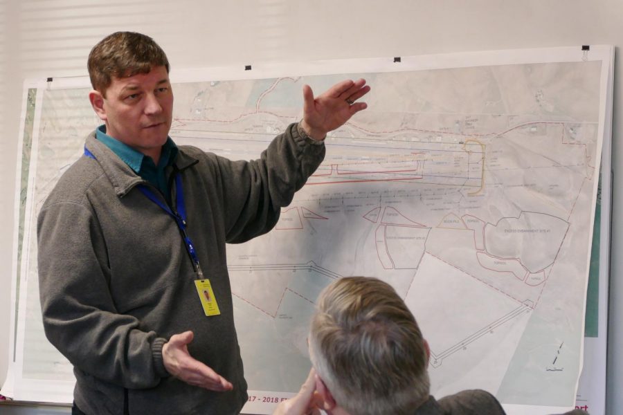 Airport Executive Director Tony Bean showcases a chart for a proposed airport extension at the airport board meeting Wednesday at the Pullman-Moscow Regional Airport.