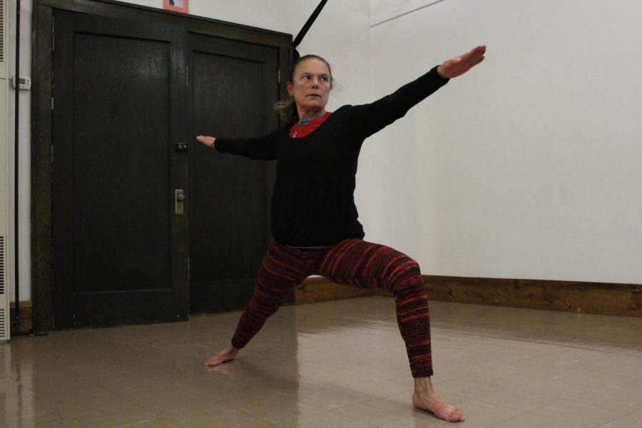Jeri Hudak, owner of Moscow Yoga Center, demonstrates the Warrior II pose Monday night at Moscow Yoga Center. This is one of the many poses that Jeri teaches beginners during the free community yoga classes offered by the Moscow Yoga Center on the first Saturday of each month.