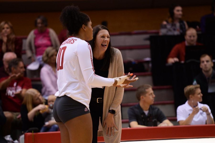 Head+Coach+Jen+Greeny+laughs+while+talking+to+senior+outside+hitter+Taylor+Mims+in+the+game+against+Utah+on+Sep.+28+in+Bohler+Gym.