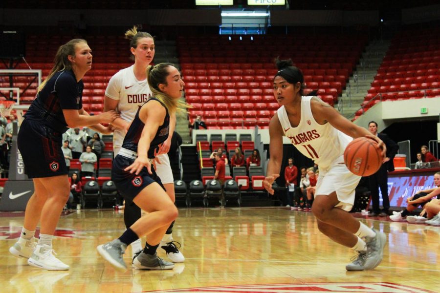 WSU+junior+guard+Chanelle+Molina+runs+towards+the+basket+as+Saint+Marys+redshirt+junior+guard+Jasmine+Forcadilla+prepares+to+stop+her+during+a+game+Nov.+11+in+Beasley+Coliseum.+