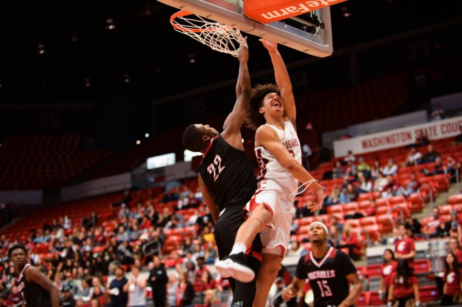 Freshman Forward CJ Elleby attempts a layup during game against Nicholls State Colonels Nov. 11 at the Bohler Gym. In only his first year at WSU, Elleby has played a key role on the Cougar team.