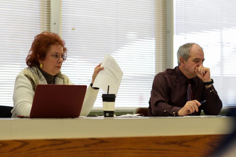 Chairwoman Sandi Brabb, left, and State Committeeman John Brabb, right, discuss James Allsup’s role as a precinct committee officer Saturday at the Commissioners Chambers. 