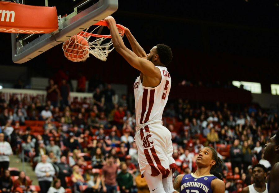 WSU sophomore small forward Marvin Cannon dunks the ball in the second half of the game against Washington on Saturday night at Beasley Coliseum. Cannon scored a season-high 25 points in the game.