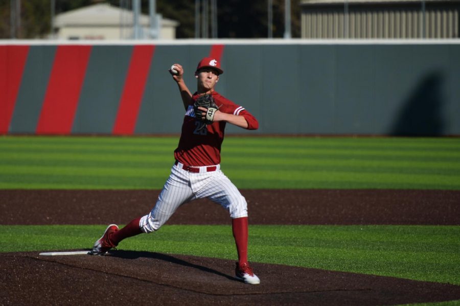 Freshman right-handed pitcher Brandon White winds up to throw the ball in the scrimmage against Gonzaga University on Oct. 21 at Bailey-Brayton Field. 